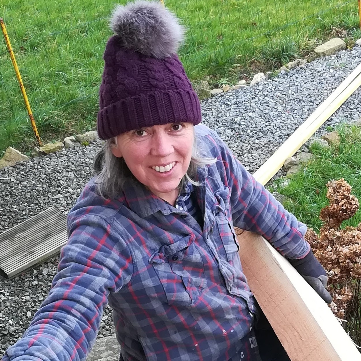 Woman holding large beam