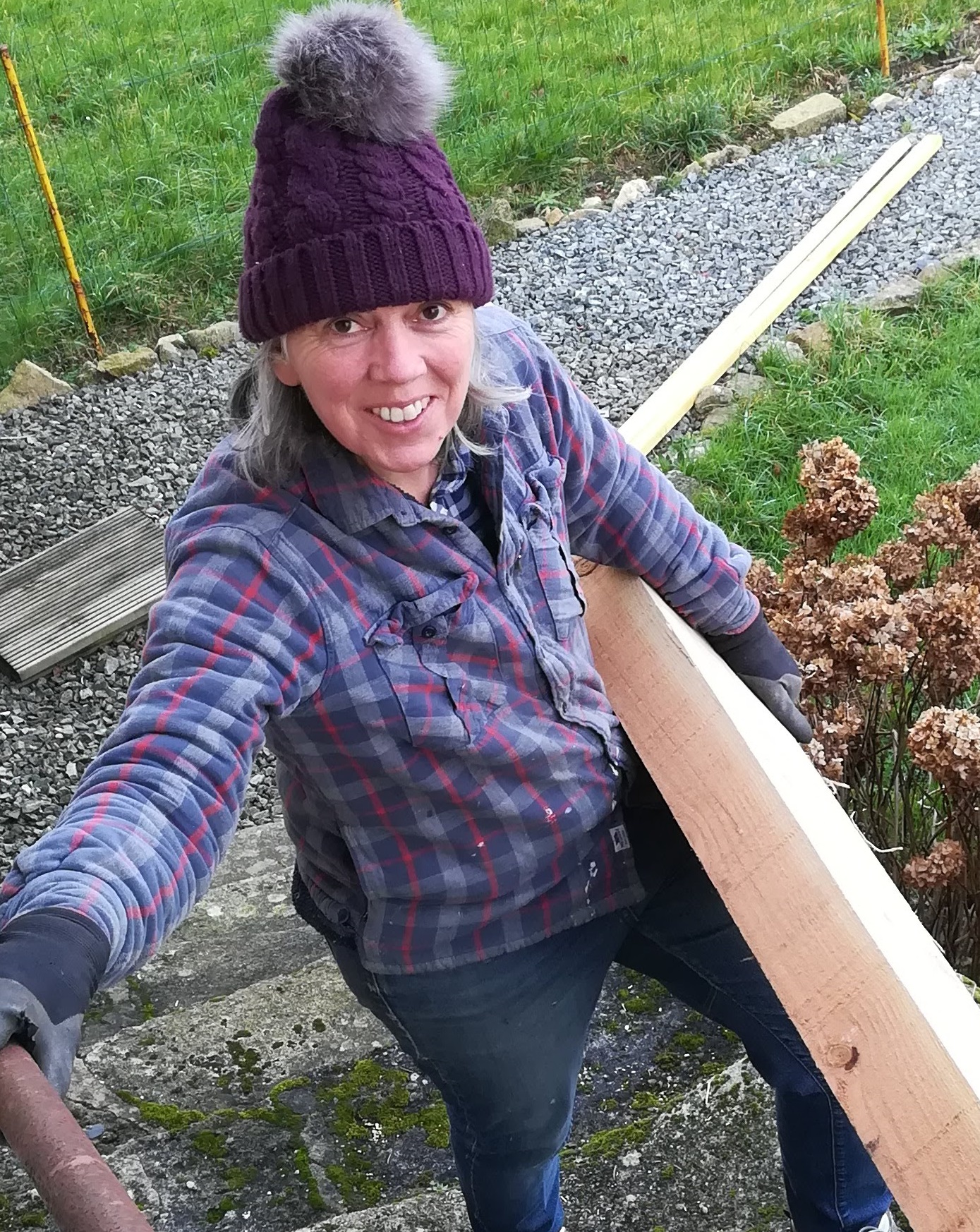 Sarah carrying wood